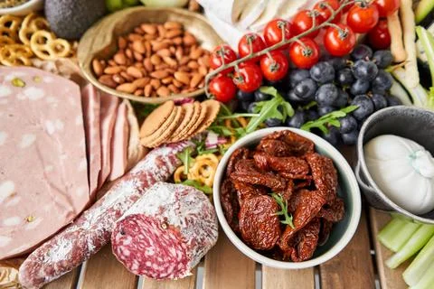 Fresh bread, pastries. Table full of mediterranean appetizers, tapas or Stock Photos