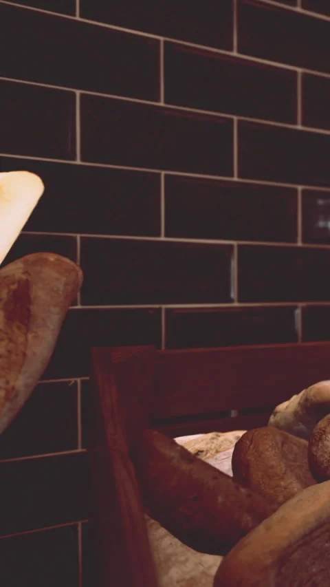 Fresh bread placed in baskets on a wooden shelf in a bakery setting Stock Footage 338351644