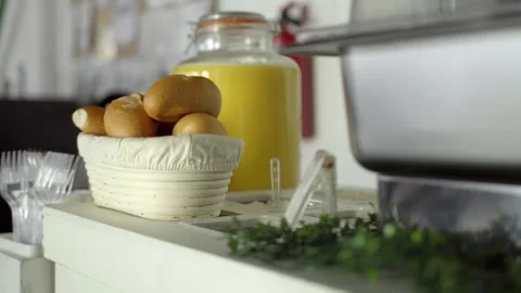 Fresh Bread Rolls and Juice Displayed on Catering Service Counter Stock Footage 336391791
