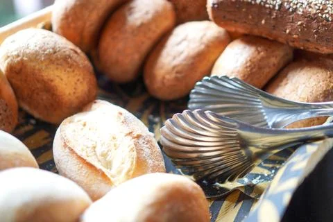 Fresh Bread Rolls in Basket on Breakfast Buffet Stock Photos