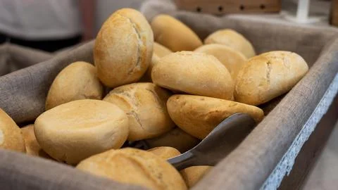 Fresh Bread Rolls in a Basket with Serving Knife Photos