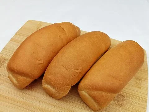 Fresh bread rolls isolated on white background Stock Photos