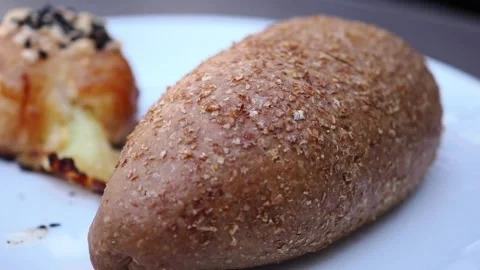 Fresh bread rolls at local bakery in the morning Stock Footage 335191160