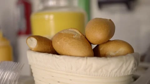 Fresh Bread Rolls Served in Basket With Juice Container on Catering Service Stock Footage 336389695