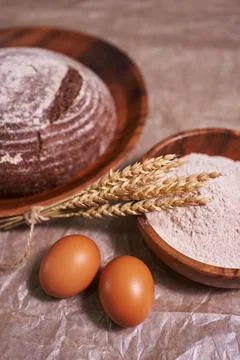 Fresh bread on rustic wooden table. Close up Stock Photos