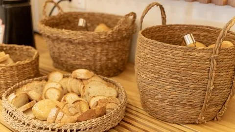 Fresh Bread Selection in Woven Baskets at Hotel Breakfast Buffet Stock Photos