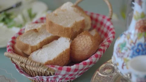 Fresh bread served in a basket on a table Stock Footage 334358872