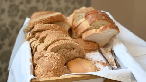 Fresh bread served in the restaurant. Sliced ​​white bread. Baked bread. Stock Footage 310025934