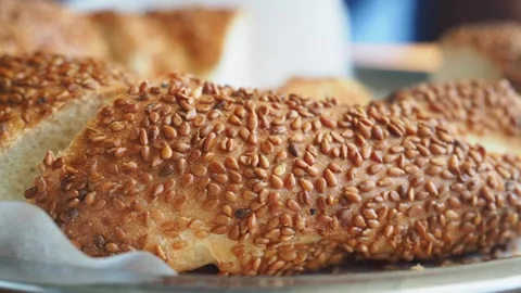 Fresh bread with sesame seeds on a silver tray Stock Footage 339755372