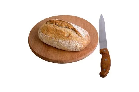Fresh bread slice and cutting knife on table Stock Photos