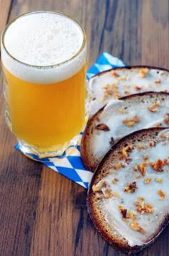 Fresh bread slice with lard and beer on oktoberfest napkin Stock Photos