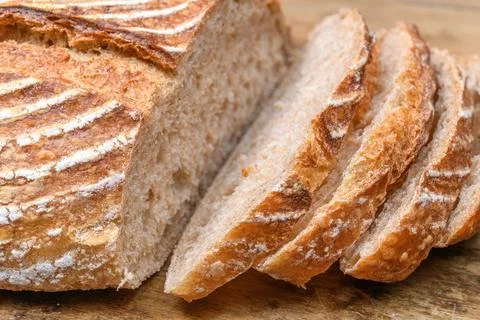 Fresh bread with spelled flour on a table 库存照片