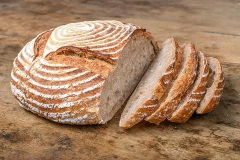 Fresh bread with spelled flour on a table Stock Photos