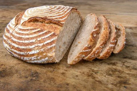 Fresh bread with spelled flour on a table Stock Photos