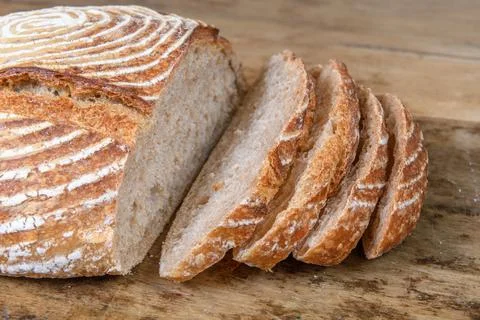 Fresh bread with spelled flour on a table Stock Photos