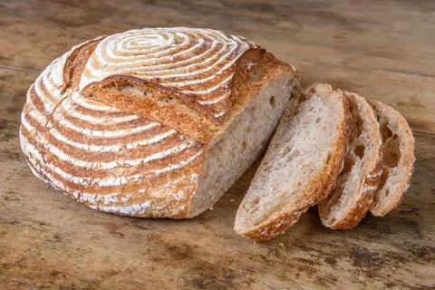 Fresh bread with spelled flour on a table Stock Photos
