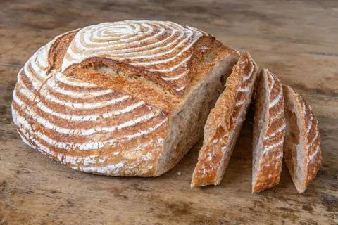 Fresh bread with spelled flour on a table Stock Photos