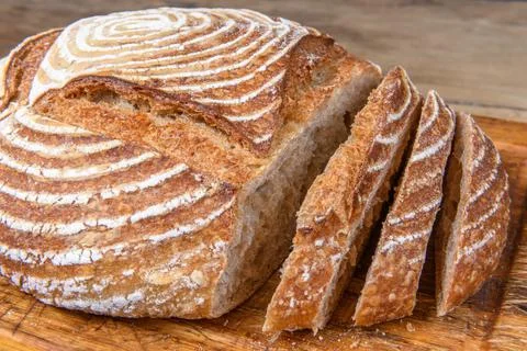 Fresh bread with spelled flour on a table Stock Photos