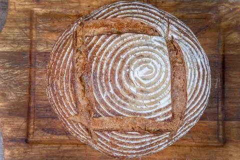 Fresh bread with spelled flour on a table Stock Photos