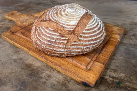 Fresh bread with spelled flour on a table Stock Photos