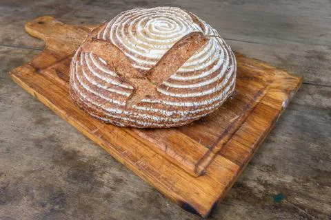Fresh bread with spelled flour on a table Stock Photos