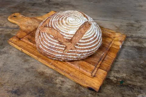 Fresh bread with spelled flour on a table Stock Photos