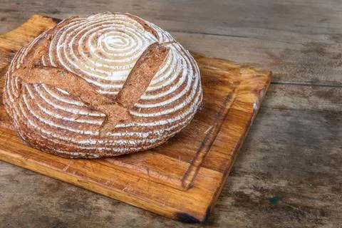 Fresh bread with spelled flour on a table Stock Photos