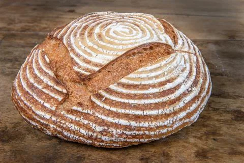 Fresh bread with spelled flour on a table Stock Photos