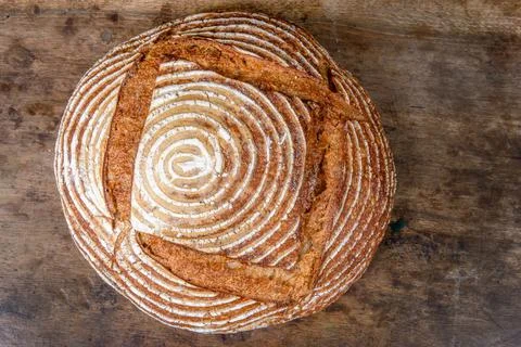 Fresh bread with spelled flour on a table Stock Photos