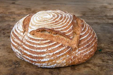 Fresh bread with spelled flour on a table Stock Photos
