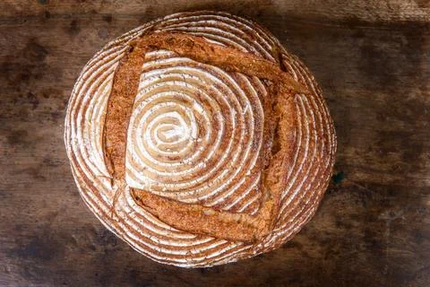 Fresh bread with spelled flour on a table Stock Photos
