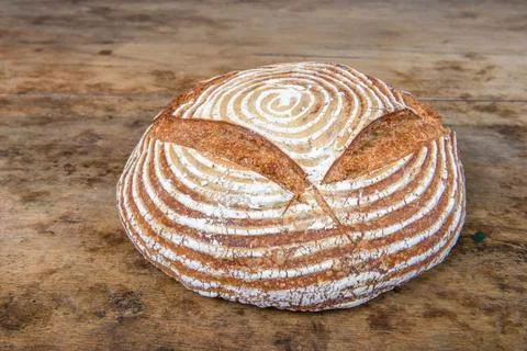 Fresh bread with spelled flour on a table Stock Photos