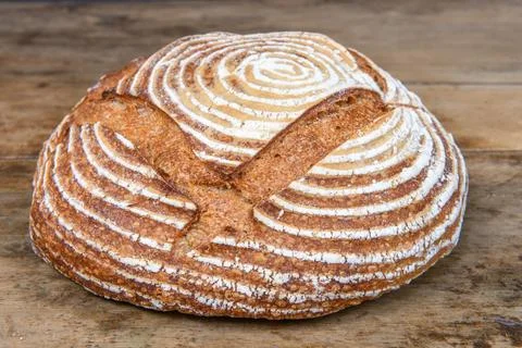 Fresh bread with spelled flour on a table Stock Photos