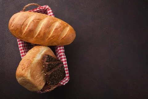 Fresh bread on stone table. Top view with space for your text Stock Photos