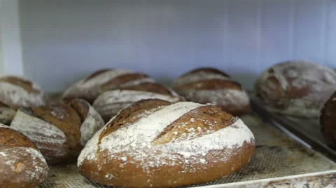 Fresh Bread Straight Out of Oven on Racks - 4K Stock Footage 51330675