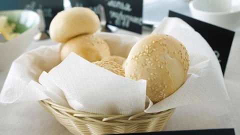 Fresh bread in a straw plate Stock Footage 127379951