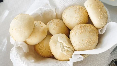 Fresh bread in a straw plate Stock Footage 127380028