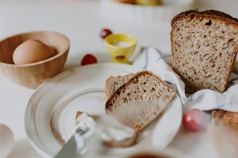 Fresh bread on the table among other breakfast products Stock Photos