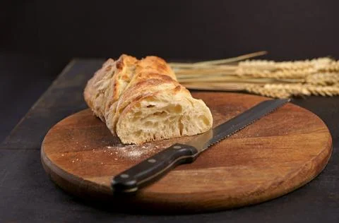 Fresh bread on table close-up. Fresh bread on the kitchen table Freshly baked Stock Photos