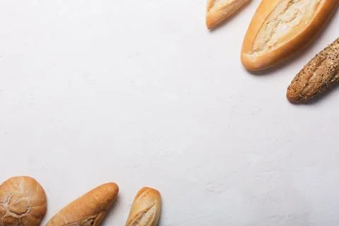 Fresh bread on a white background. Top view with copy space Stock Photos