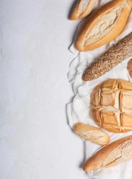 Fresh bread on a white background. Top view with copy space Stock Photos