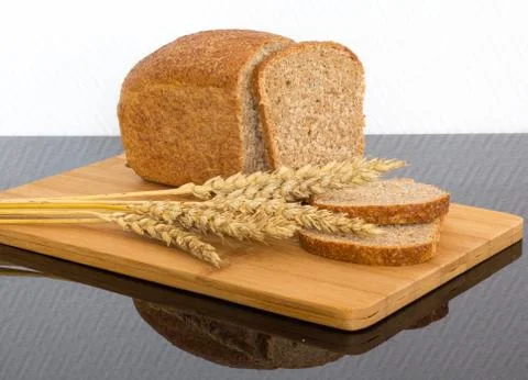 Fresh bread on the wooden board Stock Photos