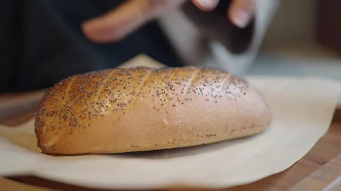 Fresh bread on wooden table at local bakery Stock Footage 344918639