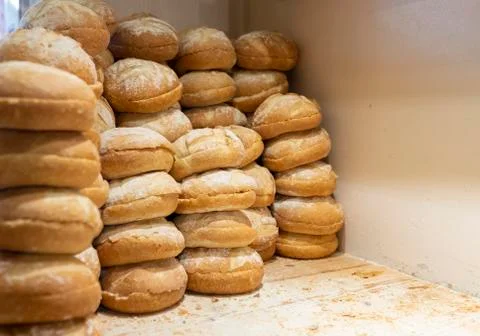 Fresh breads placed in a row in a bakery, type of french bread Stock Photos