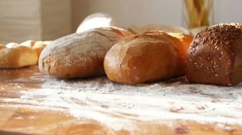 Fresh breads on the table, dolly shot Stock Footage 10735098