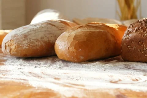 Fresh breads on the table, dolly shot Stock Footage 10735100