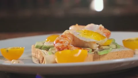 Fresh Breakfast On A Plate. Shrimp, Bread, Quail Eggs And Vegetables Stock Footage 157991527