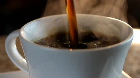 Fresh brewed coffee being poured into a cup Stock Footage
