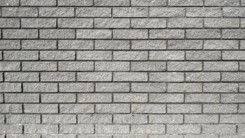 Fresh brickwork from dark bricks. Close-up. Macros. Stock Photos