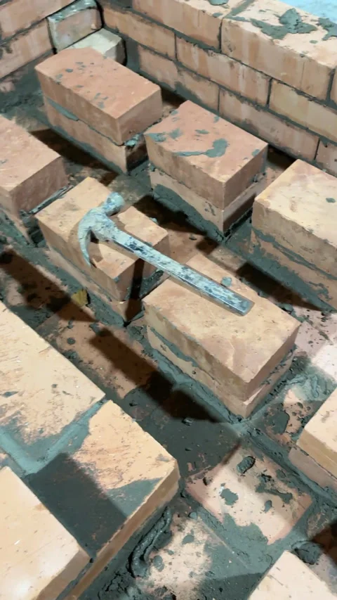 Fresh brickwork of a heating stove ash pit and bench. Smoke channels of the.. Stock Footage 325621852
